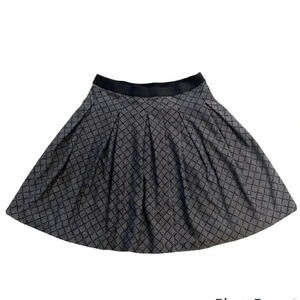 Uniqlo pleated stretch mini skirt, black,  tan geometric print. Women’s size M